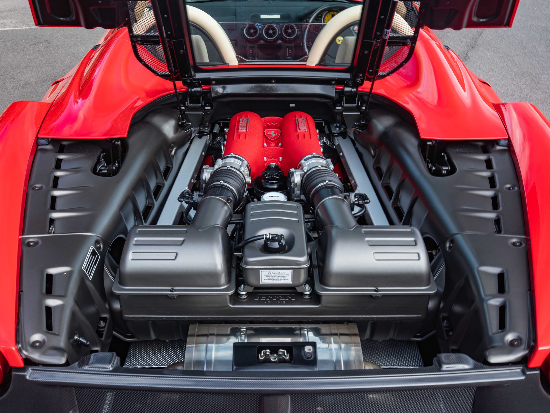 Ferrari F430 4.3 litre V8 engine bay with red intake manifolds